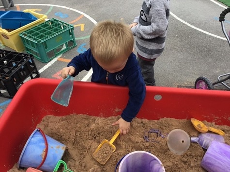 Boy playing with sand